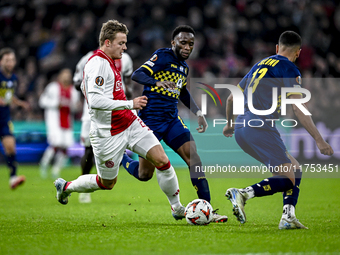 AFC Ajax Amsterdam forward Christian Rasmussen and Maccabi Tel Aviv midfielder Issouf Sissokho play during the match between Ajax and Maccab...