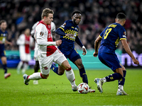 AFC Ajax Amsterdam forward Christian Rasmussen and Maccabi Tel Aviv midfielder Issouf Sissokho play during the match between Ajax and Maccab...