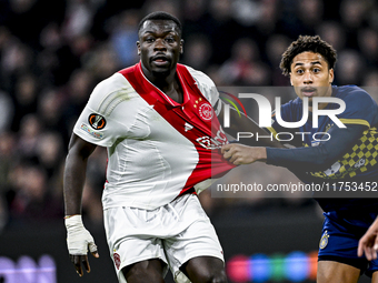 AFC Ajax Amsterdam forward Brian Brobbey and Maccabi Tel Aviv defender Tyrese Asante play during the match between Ajax and Maccabi Tel Aviv...