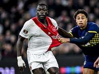 AFC Ajax Amsterdam forward Brian Brobbey and Maccabi Tel Aviv defender Tyrese Asante play during the match between Ajax and Maccabi Tel Aviv...