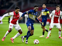 AFC Ajax Amsterdam defender Jorrel Hato and Maccabi Tel Aviv midfielder Issouf Sissokho play during the match between Ajax and Maccabi Tel A...