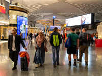 Passengers walk the allies of Istanbul Airport, in the capital of Turkiye on November 3, 2024. Istanbul Airport was named the second busiest...