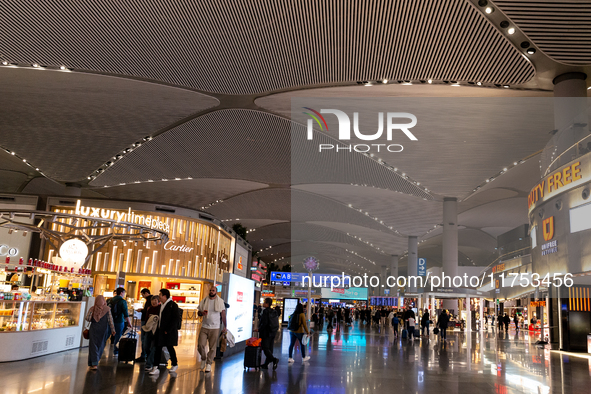 Passengers walk the allies of Istanbul Airport, in the capital of Turkiye on November 3, 2024. Istanbul Airport was named the second busiest...