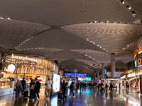 Passengers walk the allies of Istanbul Airport, in the capital of Turkiye on November 3, 2024. Istanbul Airport was named the second busiest...