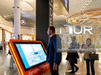 Passengers walk the allies of Istanbul Airport, in the capital of Turkiye on November 3, 2024. Istanbul Airport was named the second busiest...