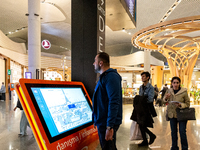 Passengers walk the allies of Istanbul Airport, in the capital of Turkiye on November 3, 2024. Istanbul Airport was named the second busiest...