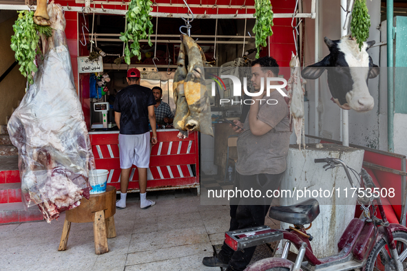 A man sells fresh meat on a small stand on a street in Kairouan, central Tunisia on October 31, 2024. Tunisia is well known for its natural...