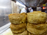 A small fresh bakes stand is seen on a street in Tunis, central Tunisia on November 2, 2024. Tunisia is well known for its natural and fresh...