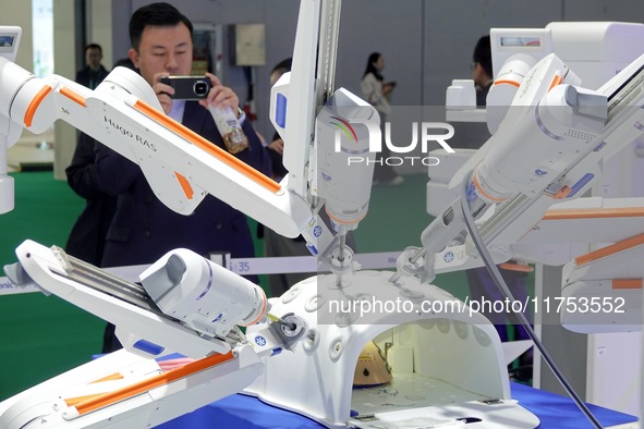 Visitors experience the Medtronic Hugo RAS robot-assisted surgery system at the 7th CIIE in Shanghai, China, on November 8, 2024. 