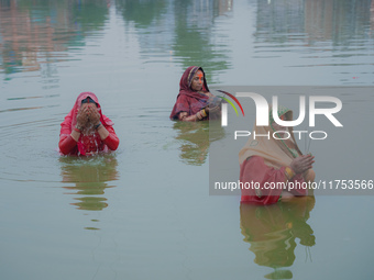 Devotees worship the rising sun in Kamalpokhari, Bhaktapur, on the last day of the Chhath Festival. Chhath is a Hindu festival dedicated to...