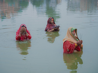 Devotees worship the rising sun in Kamalpokhari, Bhaktapur, on the last day of the Chhath Festival. Chhath is a Hindu festival dedicated to...