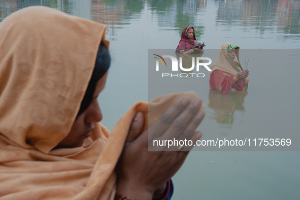 Devotees worship the rising sun in Kamalpokhari, Bhaktapur, on the last day of the Chhath Festival. Chhath is a Hindu festival dedicated to...