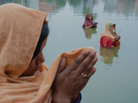 Devotees worship the rising sun in Kamalpokhari, Bhaktapur, on the last day of the Chhath Festival. Chhath is a Hindu festival dedicated to...