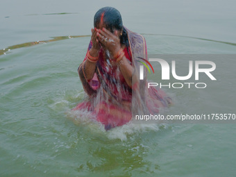 Devotees worship the rising sun in Kamalpokhari, Bhaktapur, on the last day of the Chhath Festival. Chhath is a Hindu festival dedicated to...