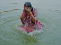 Devotees worship the rising sun in Kamalpokhari, Bhaktapur, on the last day of the Chhath Festival. Chhath is a Hindu festival dedicated to...