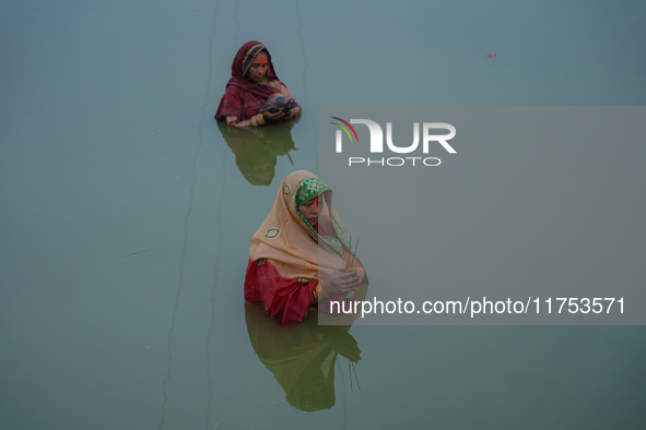 Devotees worship the rising sun in Kamalpokhari, Bhaktapur, on the last day of the Chhath Festival. Chhath is a Hindu festival dedicated to...