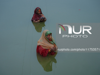 Devotees worship the rising sun in Kamalpokhari, Bhaktapur, on the last day of the Chhath Festival. Chhath is a Hindu festival dedicated to...