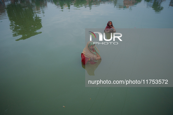 Devotees worship the rising sun in Kamalpokhari, Bhaktapur, on the last day of the Chhath Festival. Chhath is a Hindu festival dedicated to...