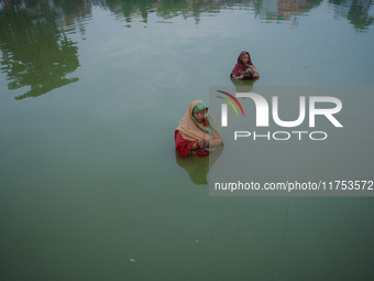 Devotees worship the rising sun in Kamalpokhari, Bhaktapur, on the last day of the Chhath Festival. Chhath is a Hindu festival dedicated to...