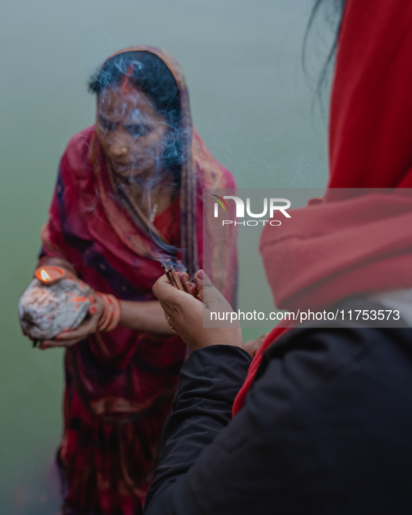 Devotees worship the rising sun in Kamalpokhari, Bhaktapur, on the last day of the Chhath Festival. Chhath is a Hindu festival dedicated to...