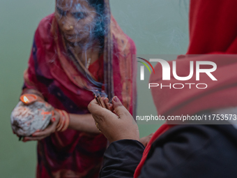 Devotees worship the rising sun in Kamalpokhari, Bhaktapur, on the last day of the Chhath Festival. Chhath is a Hindu festival dedicated to...