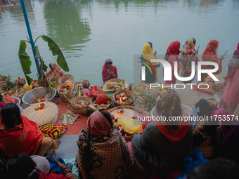 Devotees worship the rising sun in Kamalpokhari, Bhaktapur, on the last day of the Chhath Festival. Chhath is a Hindu festival dedicated to...