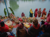 Devotees worship the rising sun in Kamalpokhari, Bhaktapur, on the last day of the Chhath Festival. Chhath is a Hindu festival dedicated to...