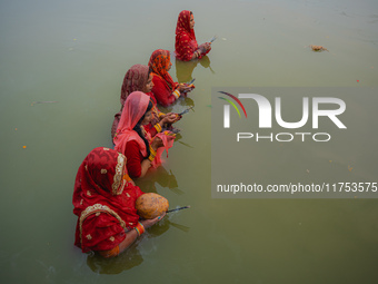 Devotees worship the rising sun in Kamalpokhari, Bhaktapur, on the last day of the Chhath Festival. Chhath is a Hindu festival dedicated to...