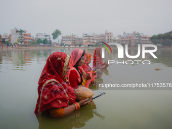 Devotees worship the rising sun in Kamalpokhari, Bhaktapur, on the last day of the Chhath Festival. Chhath is a Hindu festival dedicated to...