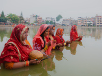 Devotees worship the rising sun in Kamalpokhari, Bhaktapur, on the last day of the Chhath Festival. Chhath is a Hindu festival dedicated to...