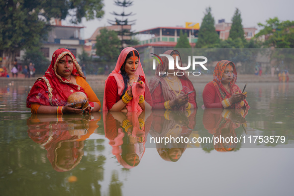 Devotees worship the rising sun in Kamalpokhari, Bhaktapur, on the last day of the Chhath Festival. Chhath is a Hindu festival dedicated to...