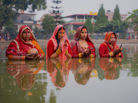 Devotees worship the rising sun in Kamalpokhari, Bhaktapur, on the last day of the Chhath Festival. Chhath is a Hindu festival dedicated to...