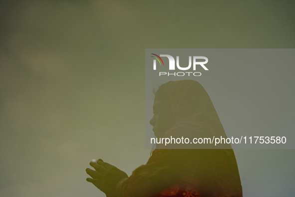 Devotees worship the rising sun in Kamalpokhari, Bhaktapur, on the last day of the Chhath Festival. Chhath is a Hindu festival dedicated to...