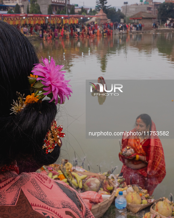 Devotees worship the rising sun in Kamalpokhari, Bhaktapur, on the last day of the Chhath Festival. Chhath is a Hindu festival dedicated to...