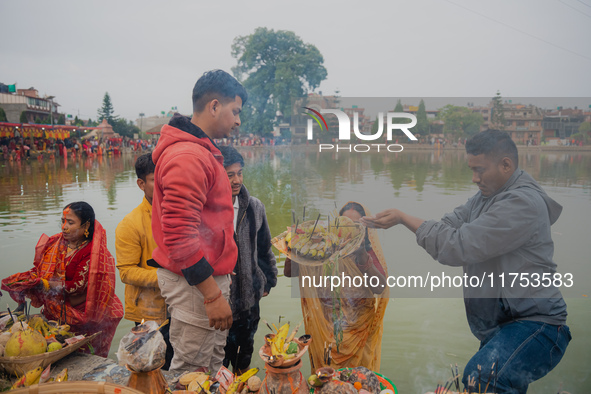 Devotees worship the rising sun in Kamalpokhari, Bhaktapur, on the last day of the Chhath Festival. Chhath is a Hindu festival dedicated to...