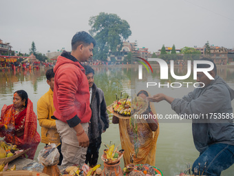 Devotees worship the rising sun in Kamalpokhari, Bhaktapur, on the last day of the Chhath Festival. Chhath is a Hindu festival dedicated to...