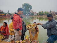 Devotees worship the rising sun in Kamalpokhari, Bhaktapur, on the last day of the Chhath Festival. Chhath is a Hindu festival dedicated to...