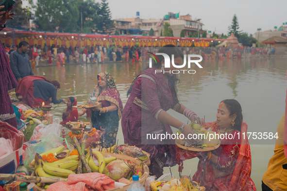 Devotees worship the rising sun in Kamalpokhari, Bhaktapur, on the last day of the Chhath Festival. Chhath is a Hindu festival dedicated to...