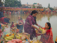 Devotees worship the rising sun in Kamalpokhari, Bhaktapur, on the last day of the Chhath Festival. Chhath is a Hindu festival dedicated to...