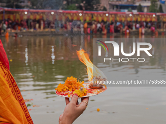 Devotees worship the rising sun in Kamalpokhari, Bhaktapur, on the last day of the Chhath Festival. Chhath is a Hindu festival dedicated to...