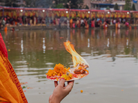 Devotees worship the rising sun in Kamalpokhari, Bhaktapur, on the last day of the Chhath Festival. Chhath is a Hindu festival dedicated to...