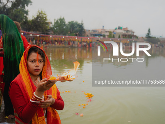 Devotees worship the rising sun in Kamalpokhari, Bhaktapur, on the last day of the Chhath Festival. Chhath is a Hindu festival dedicated to...