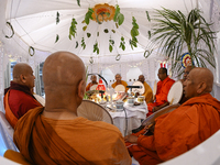 Buddhist monks chant during a pirith ceremony to invoke blessings ahead of the annual Kathina festival at Samadhi Buddhist Temple in Rollest...