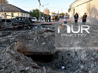 The crater from a Russian guided bomb is at an oncology dispensary in Zaporizhzhia, southeastern Ukraine, on November 7, 2024. Eight people,...