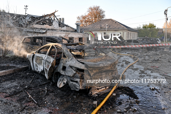 Burnt-out cars are at an oncology dispensary damaged by a Russian guided bomb strike in Zaporizhzhia, Ukraine, on November 7, 2024. Eight pe...