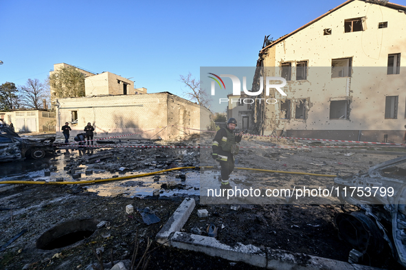 Rescuers work at an oncology dispensary damaged by a Russian guided bomb strike in Zaporizhzhia, Ukraine, on November 7, 2024. Eight people,...