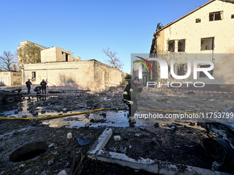 Rescuers work at an oncology dispensary damaged by a Russian guided bomb strike in Zaporizhzhia, Ukraine, on November 7, 2024. Eight people,...