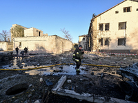 Rescuers work at an oncology dispensary damaged by a Russian guided bomb strike in Zaporizhzhia, Ukraine, on November 7, 2024. Eight people,...