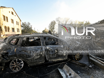 Rescuers extinguish a fire in a car at an oncology dispensary damaged by a Russian guided bomb in Zaporizhzhia, Ukraine, on November 7, 2024...