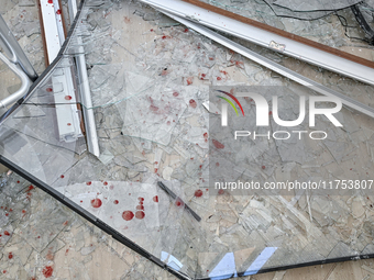 Blood drops stain glass shards at an oncology dispensary damaged by a Russian guided bomb strike in Zaporizhzhia, Ukraine, on November 7, 20...